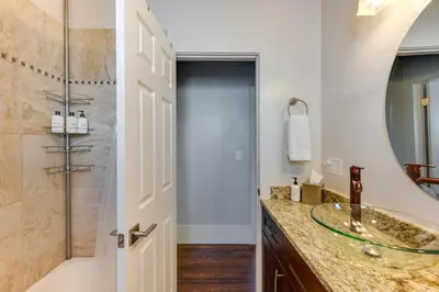 a bathroom with a sink and a shower at Furnished Patio and Yard Denver Bungalow! in Denver