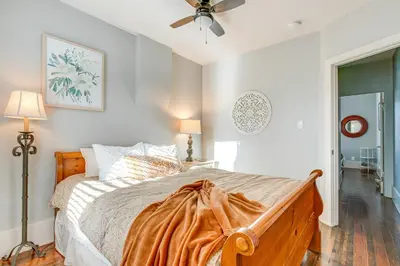 a bedroom with a bed and a ceiling fan at Furnished Patio and Yard Denver Bungalow! in Denver