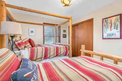 a bedroom with two beds in a room at Panoramic View Home with Hot Tub & Game Room in Black Hawk