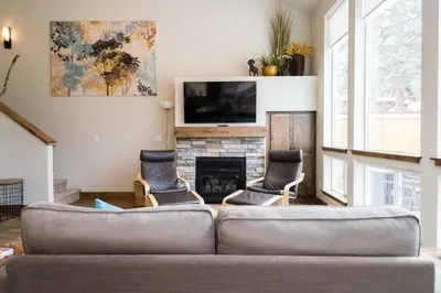 a living room with a couch and a fireplace at Sundance-2 miles to Rocky Mountain National Park in Estes Park