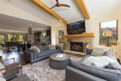 a living room with two couches and a fireplace at LUXURY HOME by the river! Walk to Shuttle, Hot Tub, Fire Pit, designer finishes!! in Breckenridge