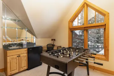 a kitchen with a large stove in the middle of a room at Warm, Spacious, and Elegant Breckenridge Home near golf course, hot tub, arcade machine, foosball in Breckenridge
