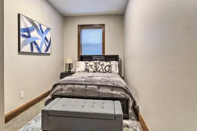 a bedroom with a bed and a window at Less Than 1 Mi to St Josephs Denver Townhome! in Denver