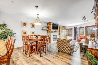 a kitchen and living room with a table and chairs at Red Hawk 2276 in Keystone