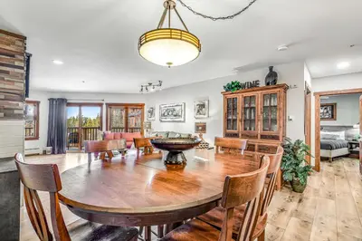 a dining room and living room with a table and chairs at Red Hawk 2276 in Keystone