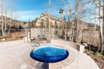 a small blue pool in a yard with a fence at Red Hawk 2276 in Keystone