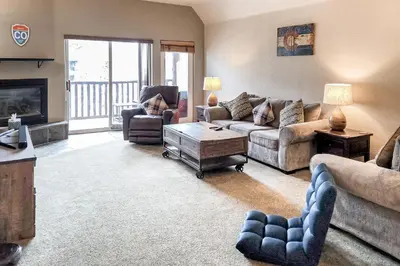 a living room with couches and chairs and a fireplace at Wish Upon a Morningstar in Frisco