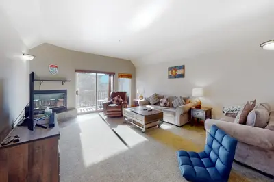 a living room with a couch and a tv at Wish Upon a Morningstar in Frisco