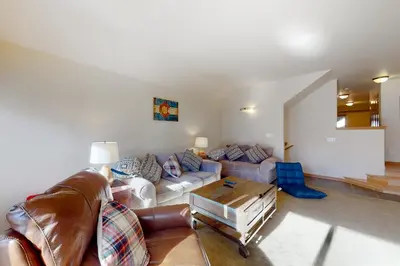 a living room with a couch and a table at Wish Upon a Morningstar in Frisco