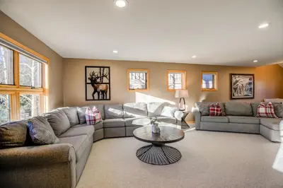 a living room with couches and a table at Crossroads Nordic Townhome: Spacious, On Bike Path in Frisco