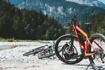 two bikes parked on a beach with mountains in the background at Crossroads Nordic Townhome: Spacious, On Bike Path in Frisco