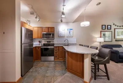 a kitchen with a sink and a stove top oven at Zephyr Mountain Lodge Premium-Rated 2108 in Winter Park