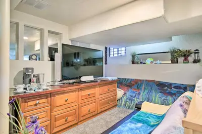 a bathroom with a sink and a large mirror at Steps to City Park and Restaurants Denver Studio in Denver