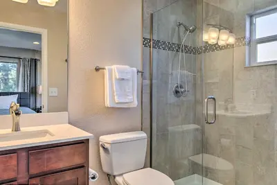 a bathroom with a shower with a toilet and a sink at Walk to Broncos Stadium Modern Denver Duplex in Denver