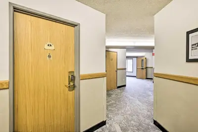 an open door in an office with a hallway at Ski-InandSki-Out Winter Park Condo with Balcony! in Winter Park