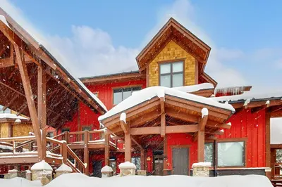 a red house with snow on the roof at Knocking at Nature's Door in Keystone