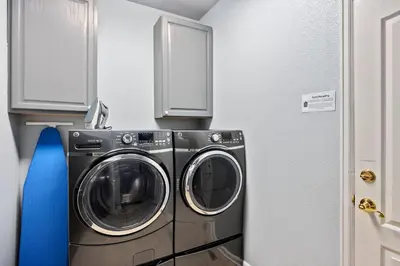 a laundry room with a washer and dryer at Family-friendly Home on Boyd Lake, Gorgeous Views! in Loveland