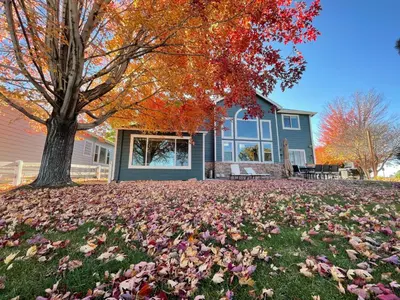 a house with a pile of leaves on the grass at Family-friendly Home on Boyd Lake, Gorgeous Views! in Loveland