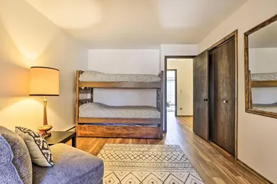 a living room with bunk beds and a couch at 7 Mi to Skiing! Mtn-View Hot Tub Haven in Frisco in Frisco