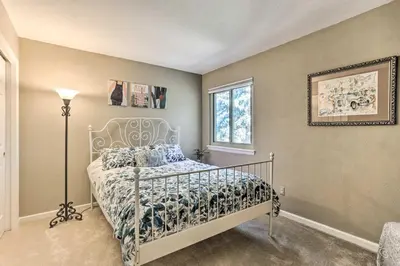 a bedroom with a bed and a window at Near Shops and Eats! Centennial Escape with Sunroom in Centennial