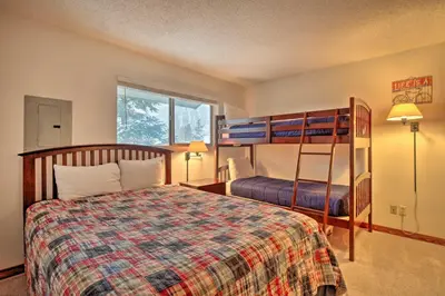 a bedroom with a bed and a bunk bed at Ski, Hike and Explore All-Season Frisco Condo in Frisco