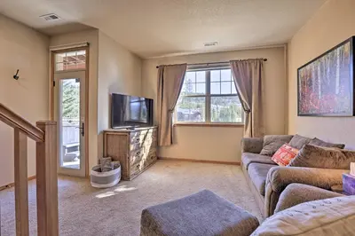 a living room with a couch and a tv at Gorgeous Fraser Townhome with Private Hot Tub! in Fraser
