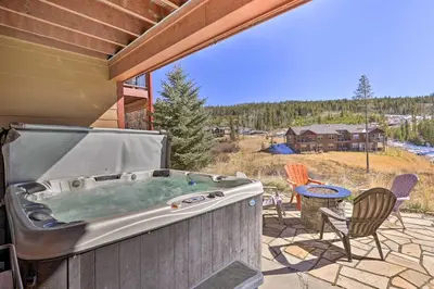 a hot tub on the patio of a house at Gorgeous Fraser Townhome with Private Hot Tub! in Fraser