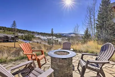three chairs and a fire pit on a patio at Gorgeous Fraser Townhome with Private Hot Tub! in Fraser