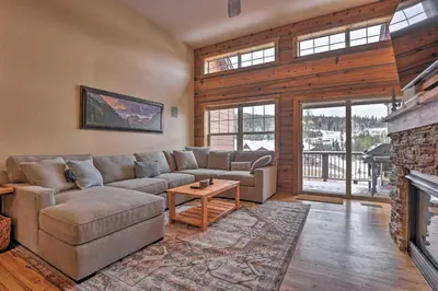 a living room with a couch and a fireplace at Gorgeous Fraser Townhome with Private Hot Tub! in Fraser