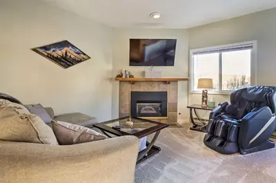 a living room with a couch and a fireplace at 4 Mi to Keystone Resort Dillon Condo with Patio in Dillon
