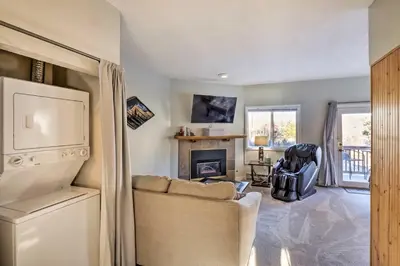 a living room with a couch and a fireplace at 4 Mi to Keystone Resort Dillon Condo with Patio in Dillon