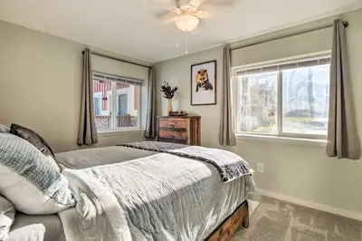 a bedroom with a bed and a window at 4 Mi to Keystone Resort Dillon Condo with Patio in Dillon