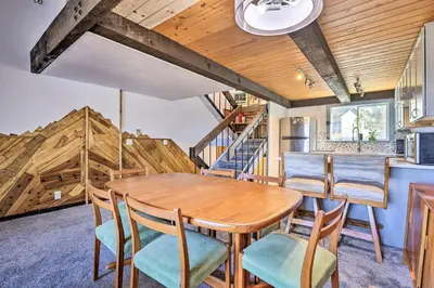 a kitchen and dining room with a wooden table and chairs at Rocky Mtn Retreat 7 Mi to Winter Park Resort in Fraser