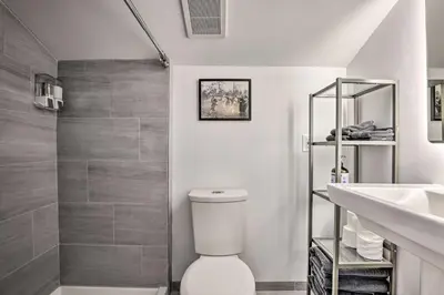 a bathroom with a toilet and a sink and a shower at Rocky Mtn Retreat 7 Mi to Winter Park Resort in Fraser