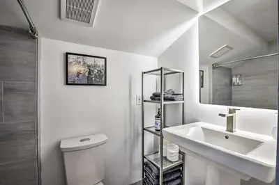 a bathroom with a sink and a toilet and a mirror at Rocky Mtn Retreat 7 Mi to Winter Park Resort in Fraser