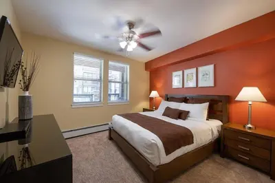 a bedroom with a bed and a ceiling fan at Winter Park FF Premium-Rated 3305 in Winter Park