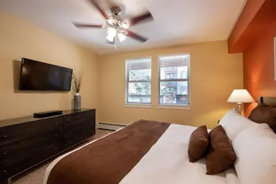 a bedroom with a bed and a flat screen tv at Winter Park FF Premium-Rated 3305 in Winter Park