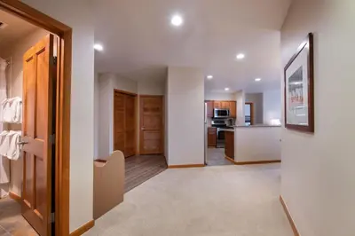a hallway with a living room and a kitchen at Zephyr Mountain Lodge Value-Rated 2508 in Winter Park