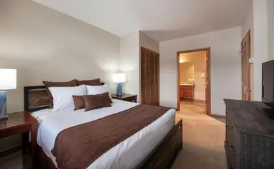 a bedroom with a large bed and a television at Zephyr Mountain Lodge Value-Rated 2508 in Winter Park