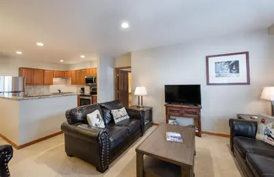 a living room with a couch and a table at Zephyr Mountain Lodge Value-Rated 2508 in Winter Park