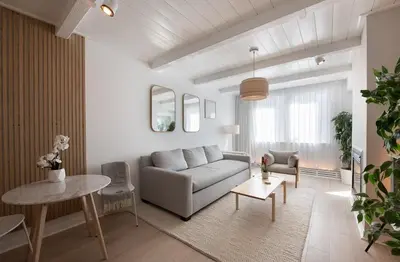 a living room with a couch and a table at Winter Park FF Premium-Rated 4564 in Winter Park