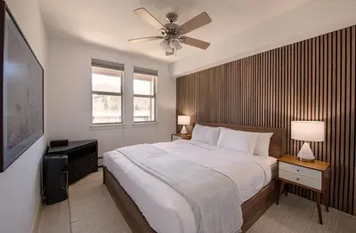 a bedroom with a large bed with a ceiling fan at Winter Park FF Premium-Rated 4564 in Winter Park