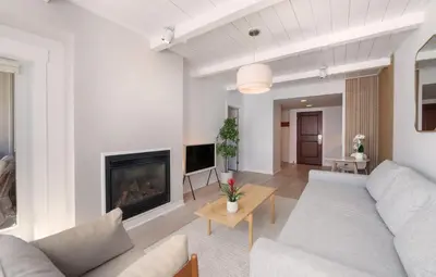 a living room with a couch and a fireplace at Winter Park FF Premium-Rated 4564 in Winter Park