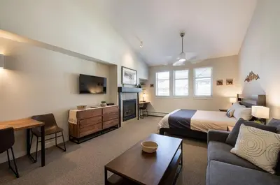 a hotel room with a bed and a couch at Winter Park FF Premium-Rated 4669 in Winter Park
