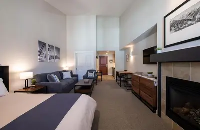 a hotel room with a bed and a fireplace at Winter Park FF Premium-Rated 4669 in Winter Park