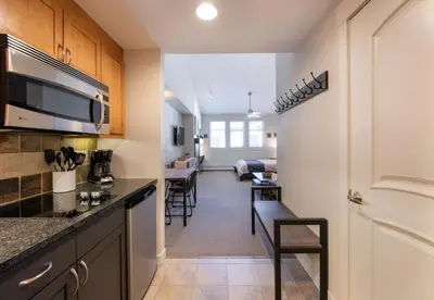 a kitchen with a counter and a living room at Winter Park FF Premium-Rated 4669 in Winter Park