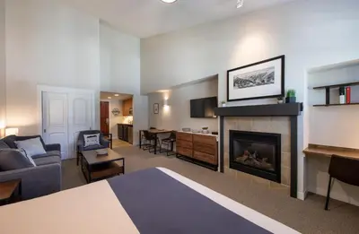 a hotel room with a bed and a fireplace at Winter Park FF Premium-Rated 4669 in Winter Park