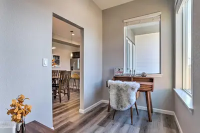 a room with a desk and a mirror at 6 Mi to Dtwn Denver Townhome with Patio! in Thornton