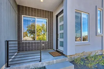 a front door of a house with a window at 6 Mi to Dtwn Denver Townhome with Patio! in Thornton