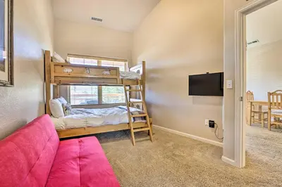 a room with a bunk bed and a couch at Spacious Fraser Condo about 6 Mi to Winter Park! in Fraser